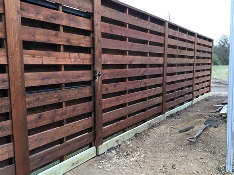 building a shadow box fence with round steel posts|horizontal shadow box fence panels.